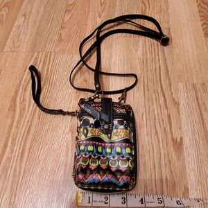 Wallet with wrislet and cross body strap